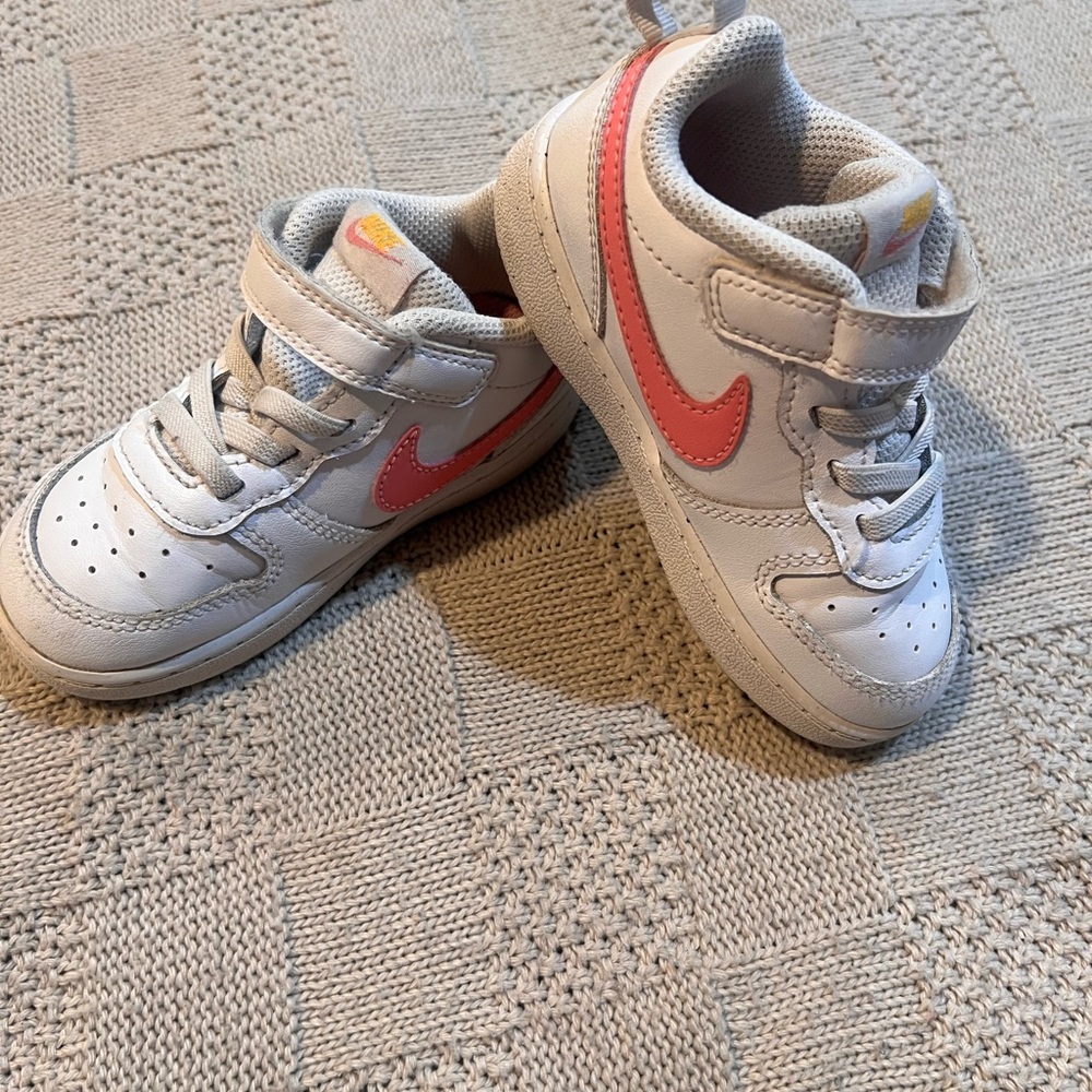Nike Kids White Sneakers with Pink Swoosh and Light Gray Details